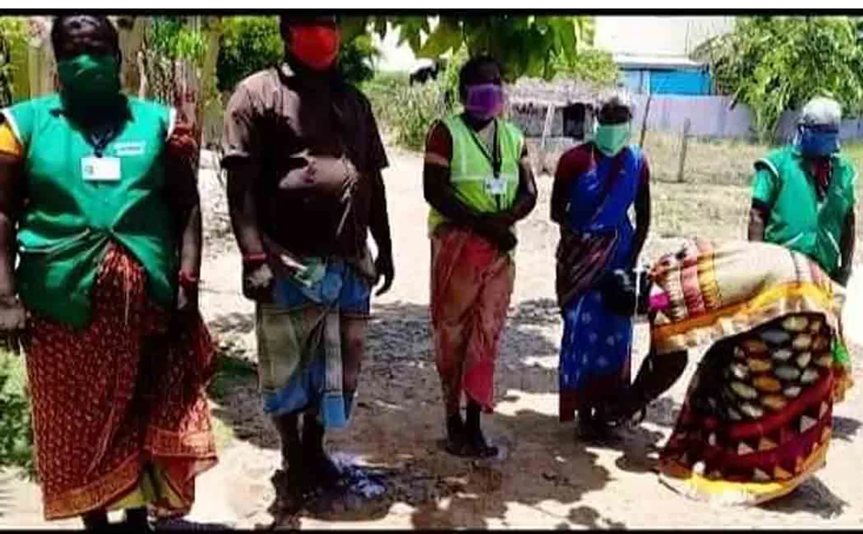 sanitary workers one couple provide some vegtables and grocery products 